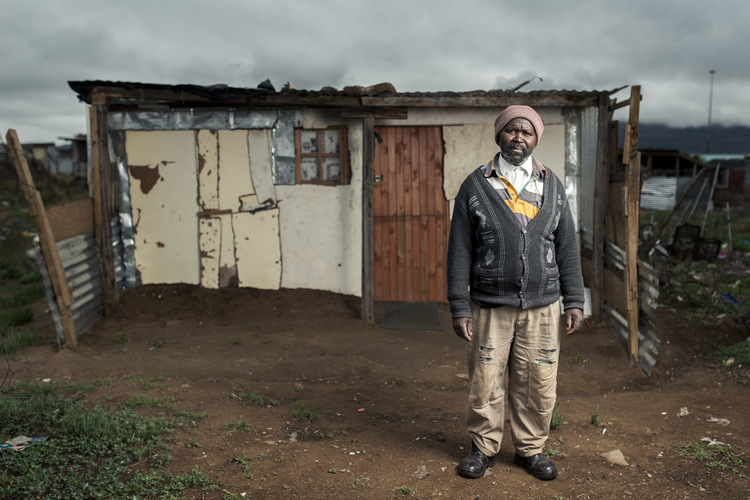 Mthuthuzeli Mtshange infront of his shack on the outskirts of Queenstown, Eastern Cape.%26#160;